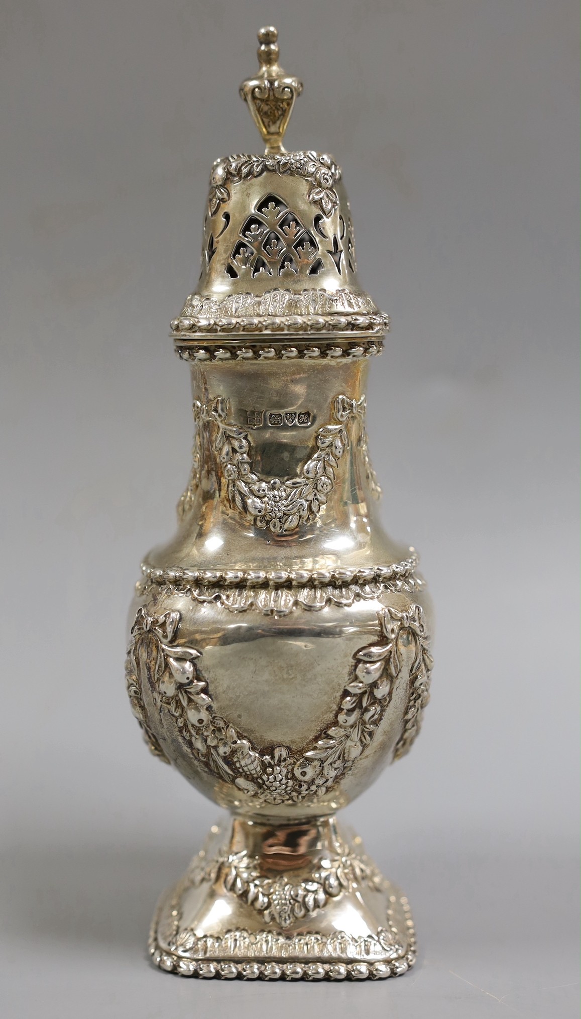 An Edwardian ornate silver sugar caster, Nathan & Hayes, Chester, 1908, 18.6cm, 7oz.